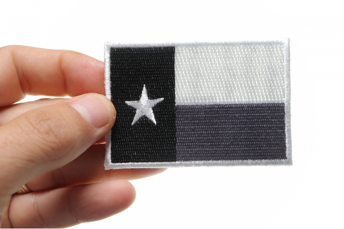 Monochrome Texas Flag Patch shown on hand for size comparison