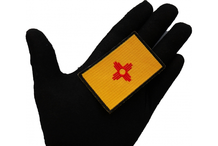 New Mexico State Flag Path shown on hand for size comparison