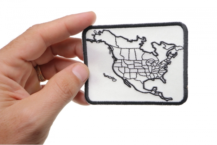 North America Color In Patch Small shown on hand for size comparison
