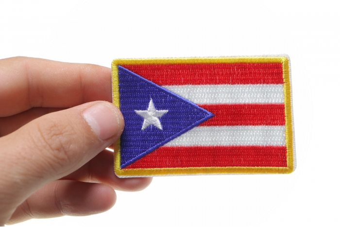 Puerto Rican Flag shown on hand for size comparison
