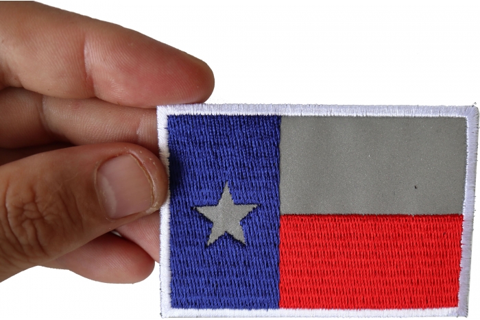 Reflective Texas Flag Patch shown on hand for size comparison