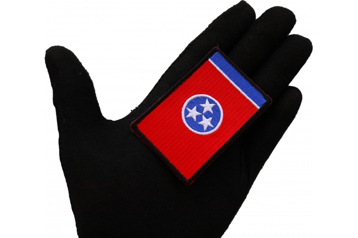Tennessee State Flag Patch shown on hand for size comparison