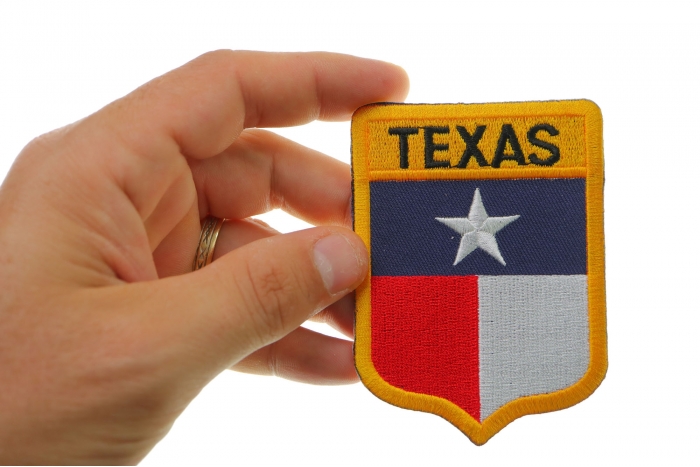 Texas Shield Patch shown on hand for size comparison