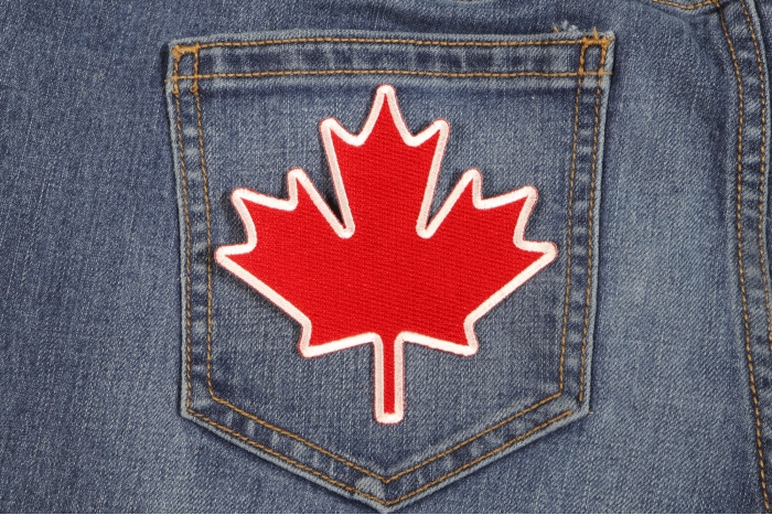 Canada Maple Leaf Iron on Patch shown on jeans