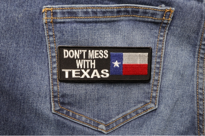 Don't Mess With Texas Patch With Flag shown on jeans