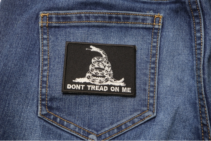Don't Tread On Me Black White Patch shown on jeans