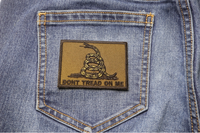 Don't Tread On Me Gadsden Flag Black Over Army Green Patch shown on jeans