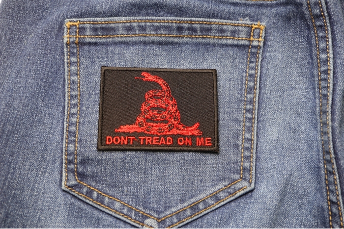 Don't Tread On Me Gadsden Flag Red Over Black Patch shown on jeans