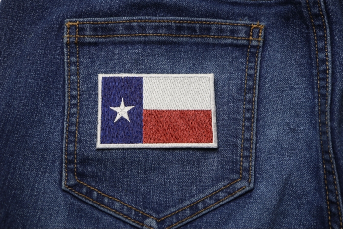 Texas Flag Patch in subdued colors shown on jeans