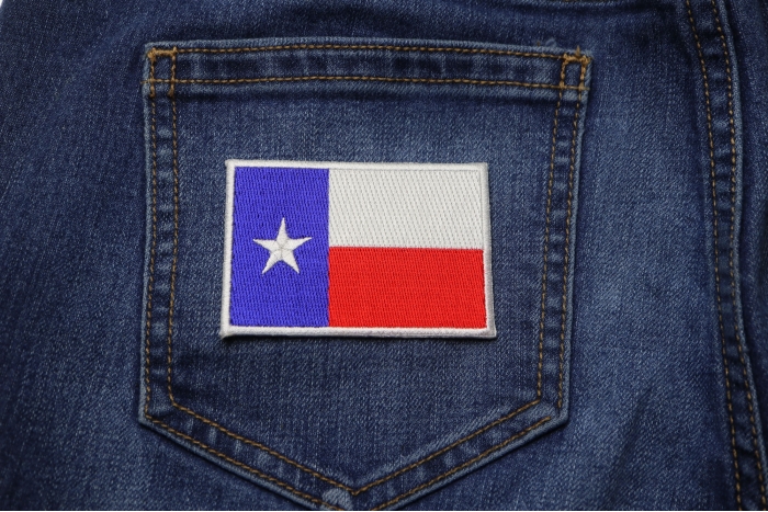 Texas Flag White Border Patch shown on jeans