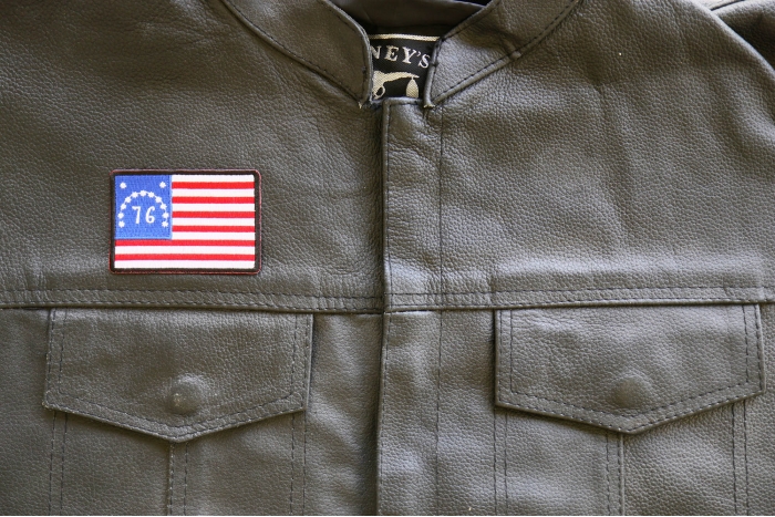 76 American Flag Patch shown on leather vest