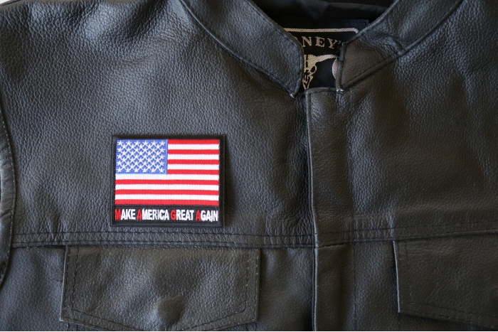Make America Great Again MAGA US Flag Patch - 3x2.75 inch - Embroidered Iron on Patch shown on leather vest
