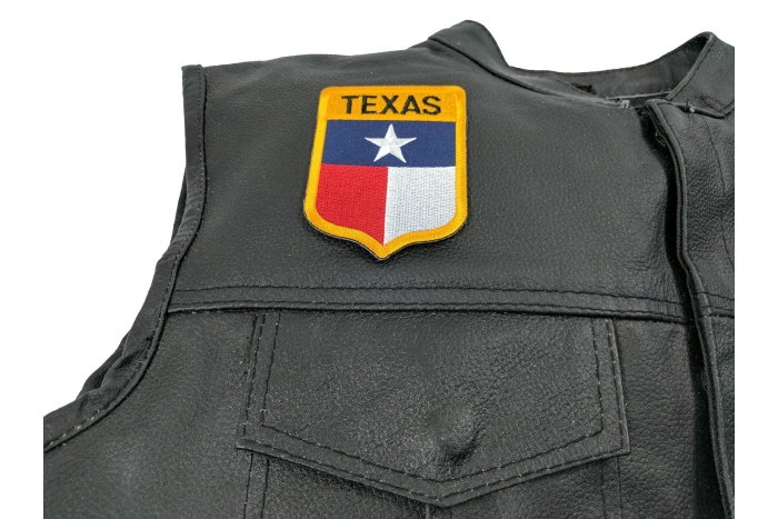 Texas Shield Patch - 2.75x3.5 inch. Embroidered Iron on Patch shown on leather vest