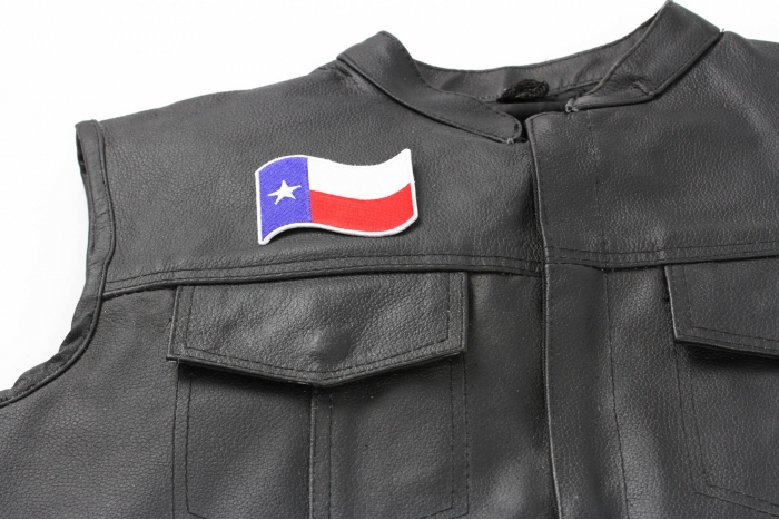 Texas Waving Flag White Border Patch - 3x2 inch. Embroidered Iron on Patch shown on leather vest
