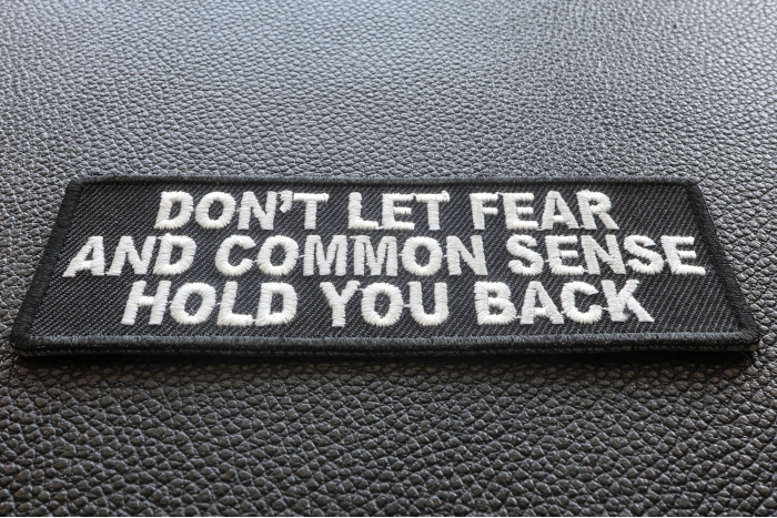 Don't Let Fear and Common Sense Hold You Back Funny Iron on Patch diagonal view