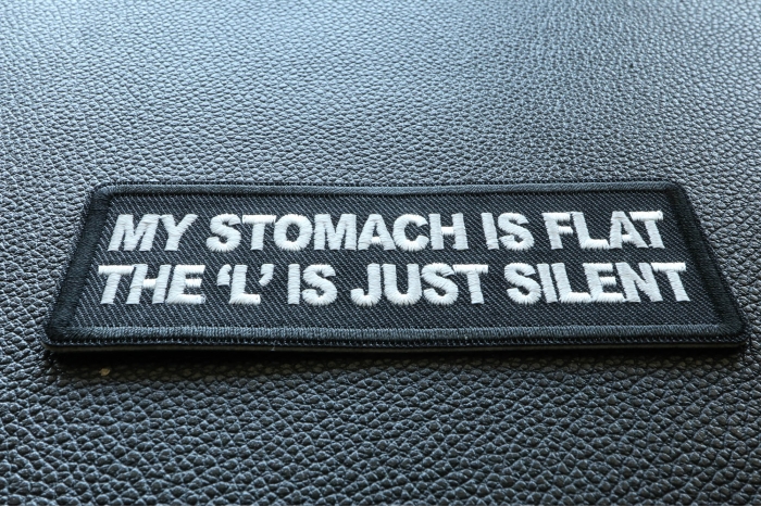 My Stomach is Flat, The L is just Silent Funny Iron on Patch diagonal view