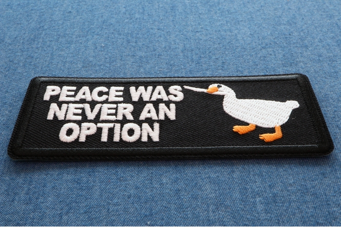 Peace Was Never an Option Duck with Knife Iron on Patch diagonal view