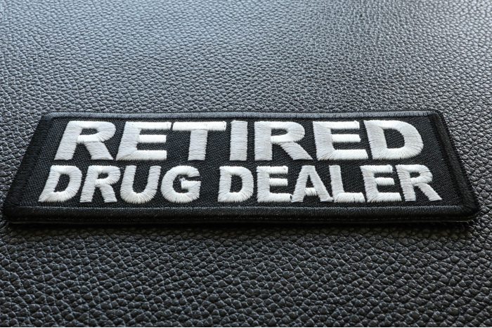 Retired Drug Dealer Funny Iron on Patch diagonal view