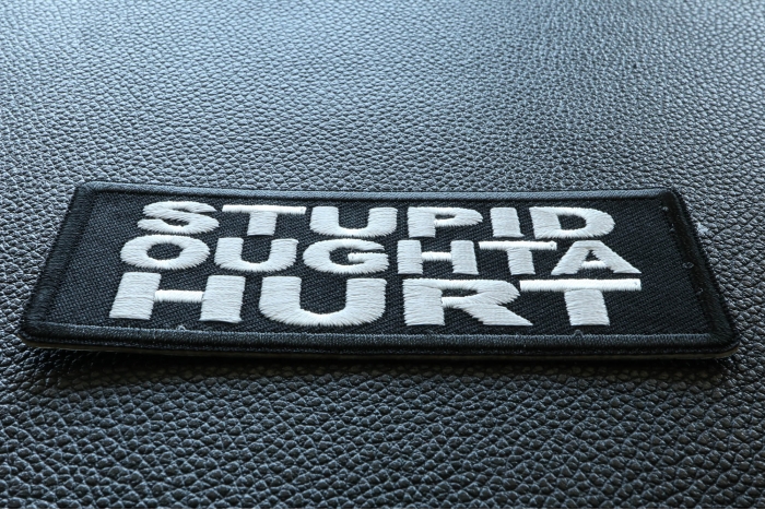 Stupid Oughta Hurt Funny Iron on Patch diagonal view
