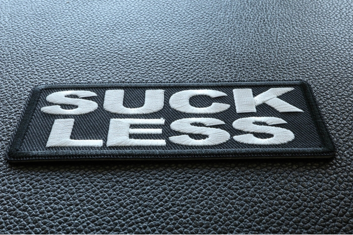 Suck Less Funny Iron on Patch diagonal view