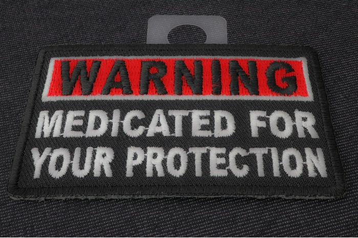 Warning Medicated For Your Protection Funny Iron on Patch diagonal view