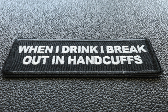 When I drink I break out in Handcuffs Funny Iron on Patch diagonal view