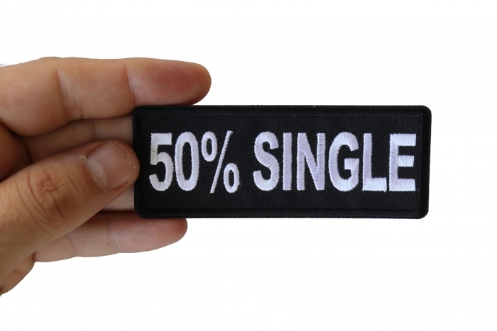 50 Percent Single Funny Iron on Patch shown on hand for size comparison