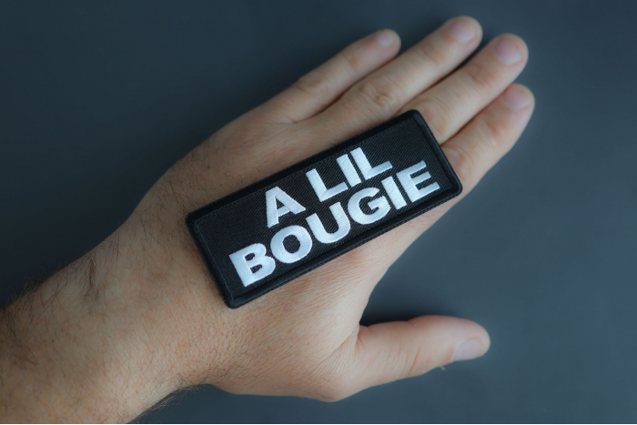 A Lil Bougie Patch shown on hand for size comparison