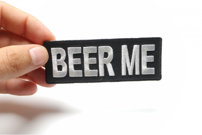 Beer Me Funny Iron on Patch shown on hand for size comparison