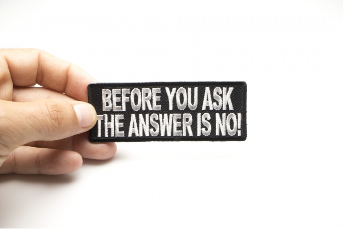 Before You Ask The Answer Is No Funny Iron on Patch shown on hand for size comparison