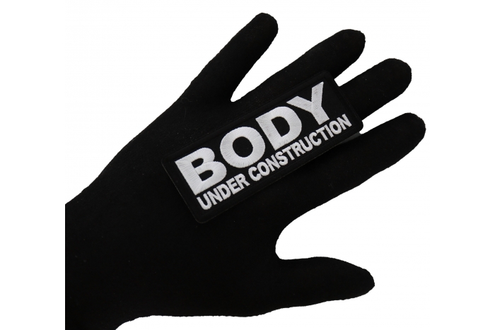 Body under construction Patch, Funny Saying Patches shown on hand for size comparison