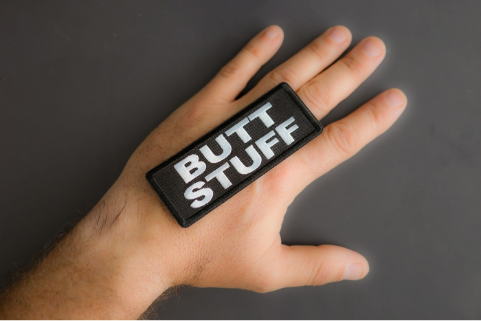 Butt Stuff Patch shown on hand for size comparison