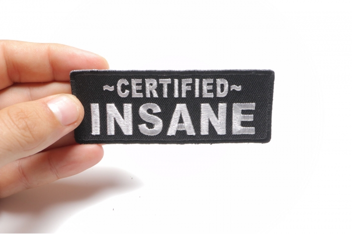 Certified INSANE Funny Iron on Patch shown on hand for size comparison