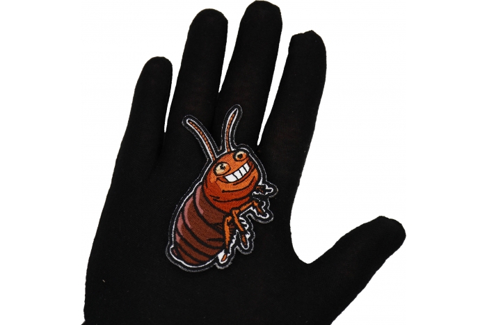 Cockroach Patch shown on hand for size comparison