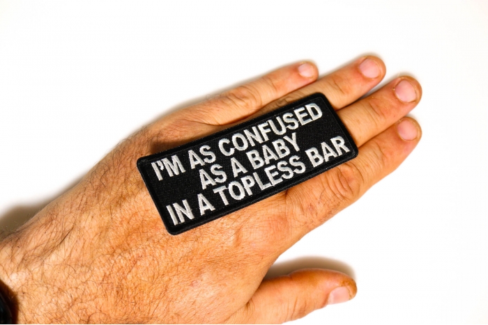 I'm As Confused As Baby In Topless Bar Patch, Funny Saying Patches shown on hand for size comparison