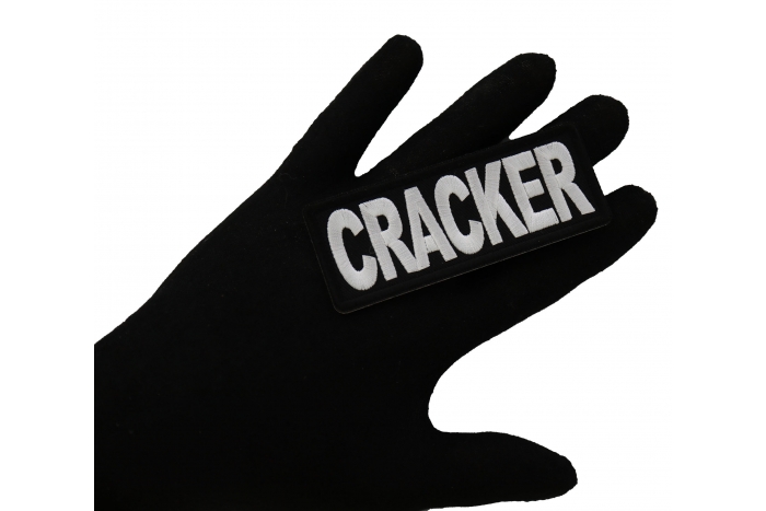 Cracker Funny Iron on Patch shown on hand for size comparison