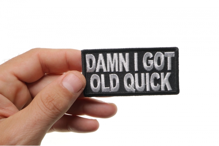 Damn I Got Old Quick Patch, Biker Sayings shown on hand for size comparison