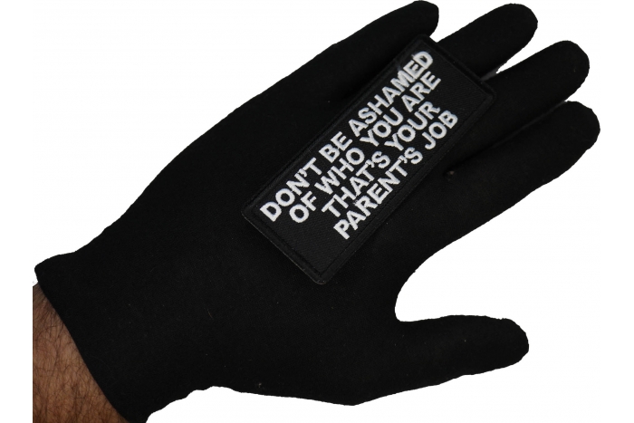 Don't Be Ashamed of Who You are That's Your Parents Job Patch shown on hand for size comparison