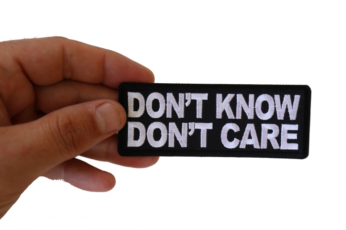 Don't Know Don't Care Funny Iron on Patch shown on hand for size comparison