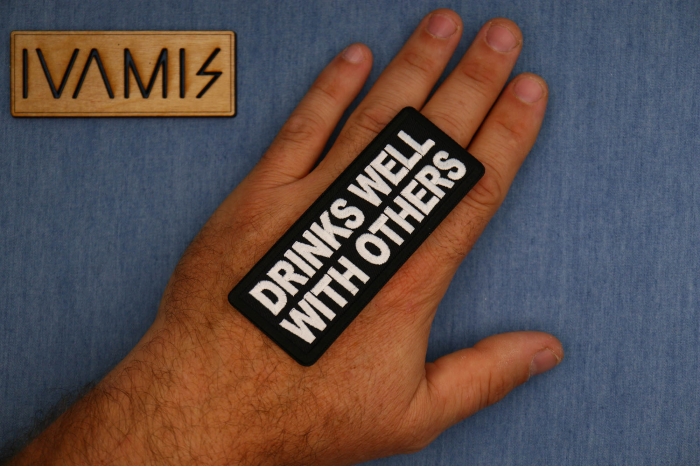 Drinks Well with Others Patch, Funny Saying Patches, Sew or Iron on shown on hand for size comparison