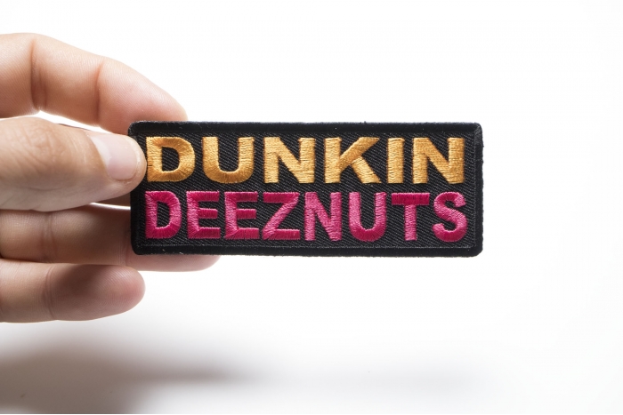 Dunkin Deeznuts Funny Iron on Patch shown on hand for size comparison
