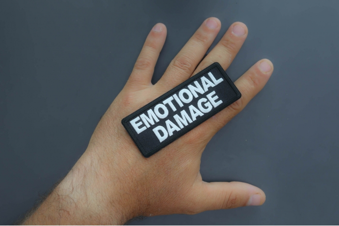 Emotional Damage Patch shown on hand for size comparison