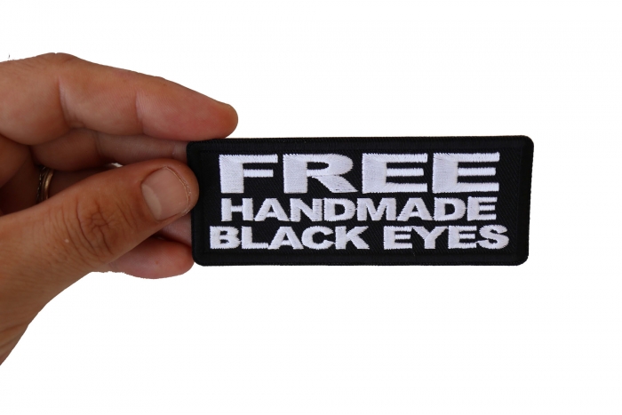 Free Handmade Black Eyes Patch, Funny Saying Patches shown on hand for size comparison