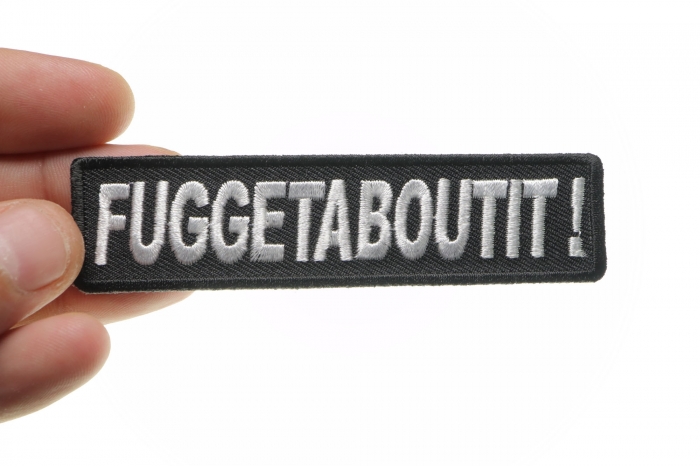 Fuggetaboutit Funny Iron on Patch shown on hand for size comparison