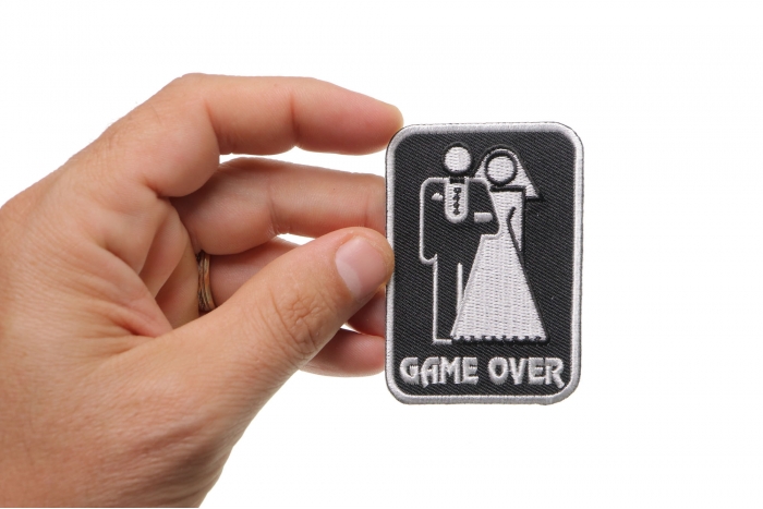 Game Over Marriage Funny Iron on Patch shown on hand for size comparison