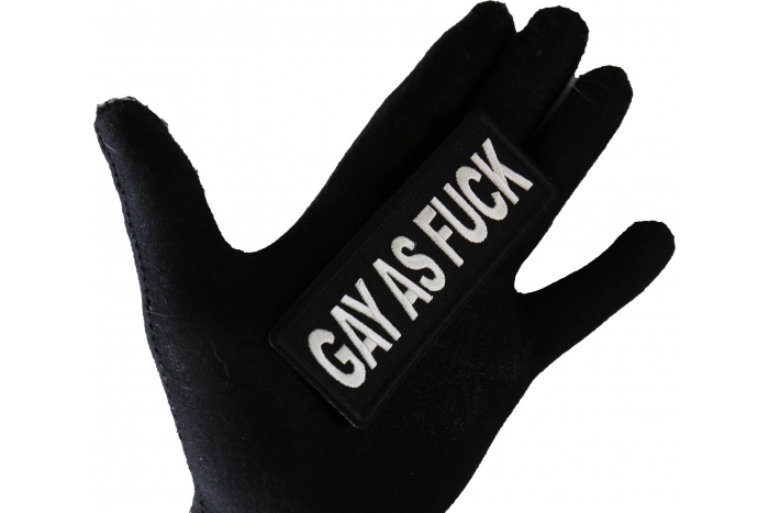 Gay as Fuck Funny Iron on Patch shown on hand for size comparison