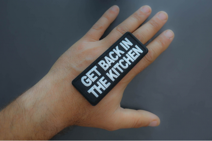 Get back in the kitchen patch shown on hand for size comparison