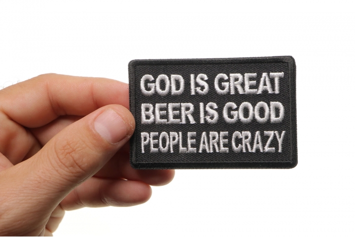 God is Great Beer is Good People Are Crazy Funny Iron on Patch shown on hand for size comparison