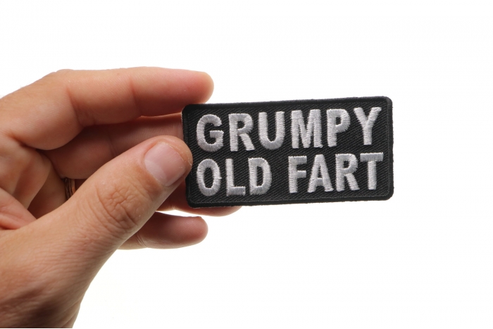 Grumpy Old Fart Funny Iron on Patch shown on hand for size comparison