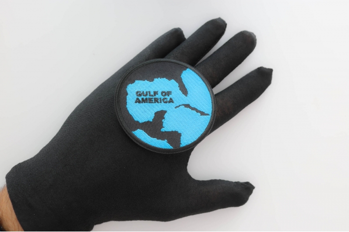 Gulf of America Patch shown on hand for size comparison